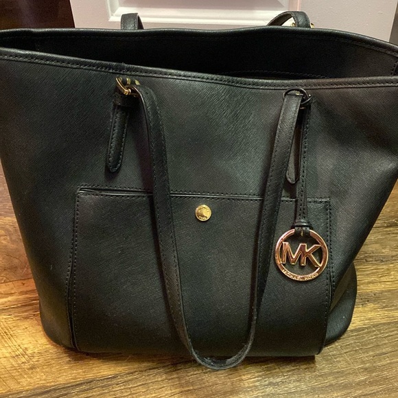 Michael Kors Handbags - Michael Kors black bag (handles have some wear) with multiple compartments.
